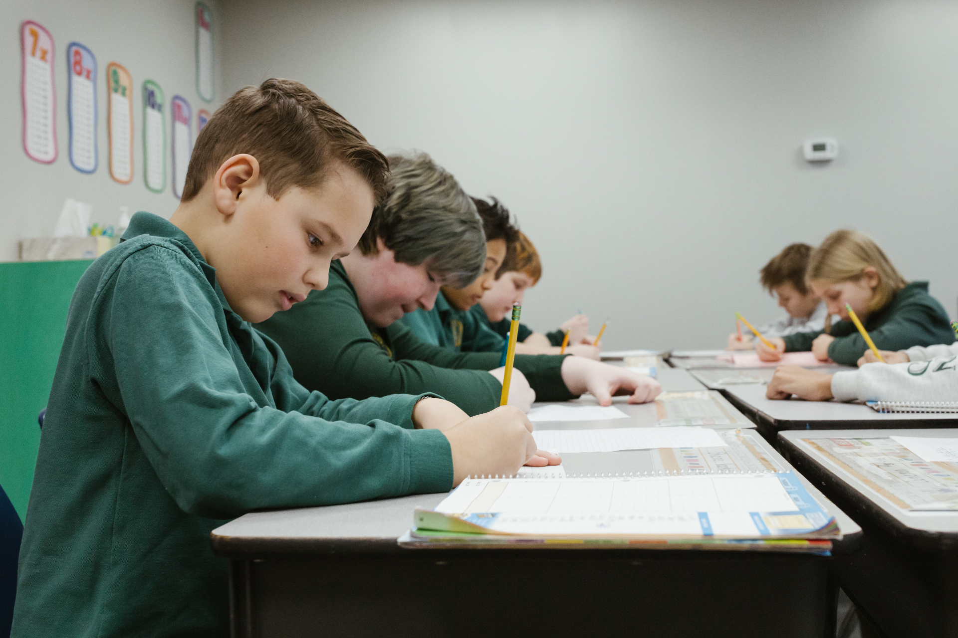 Highland Academy students writing at their desks