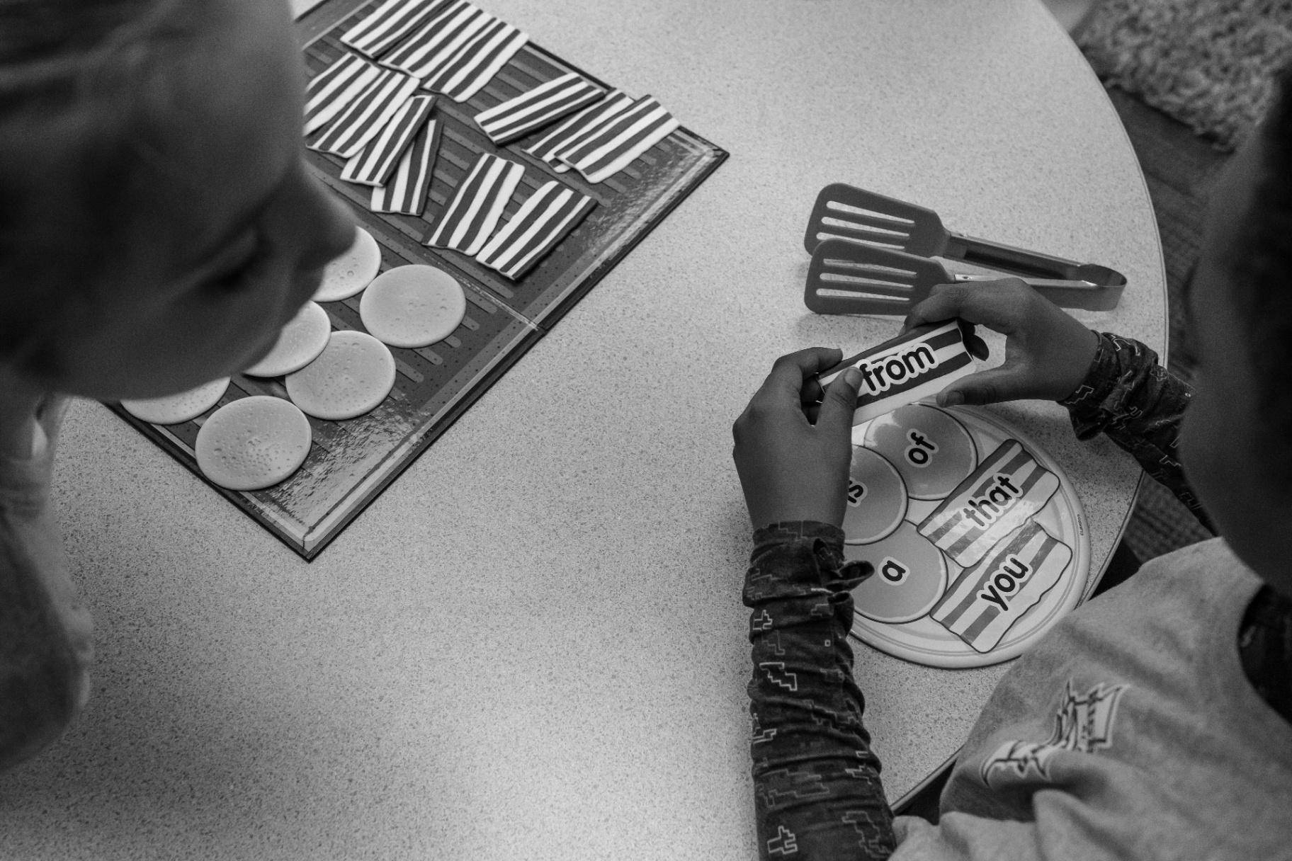 Highland Academy student working with sight word learning materials